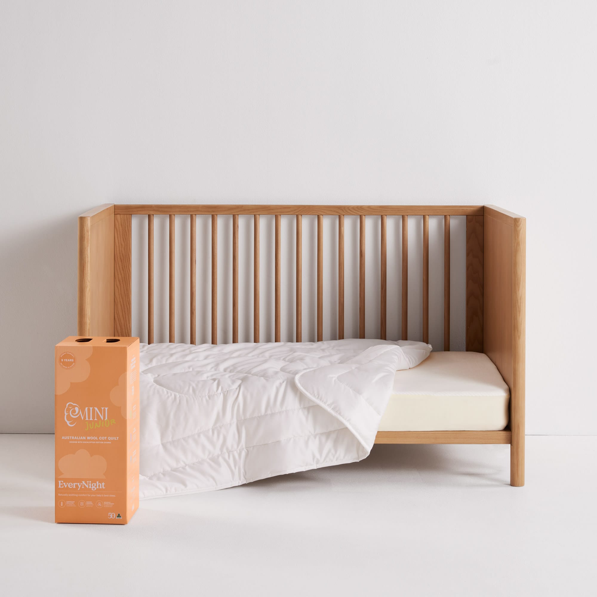 EveryNight Baby Quilt on cot with packaging - thumbnail #2