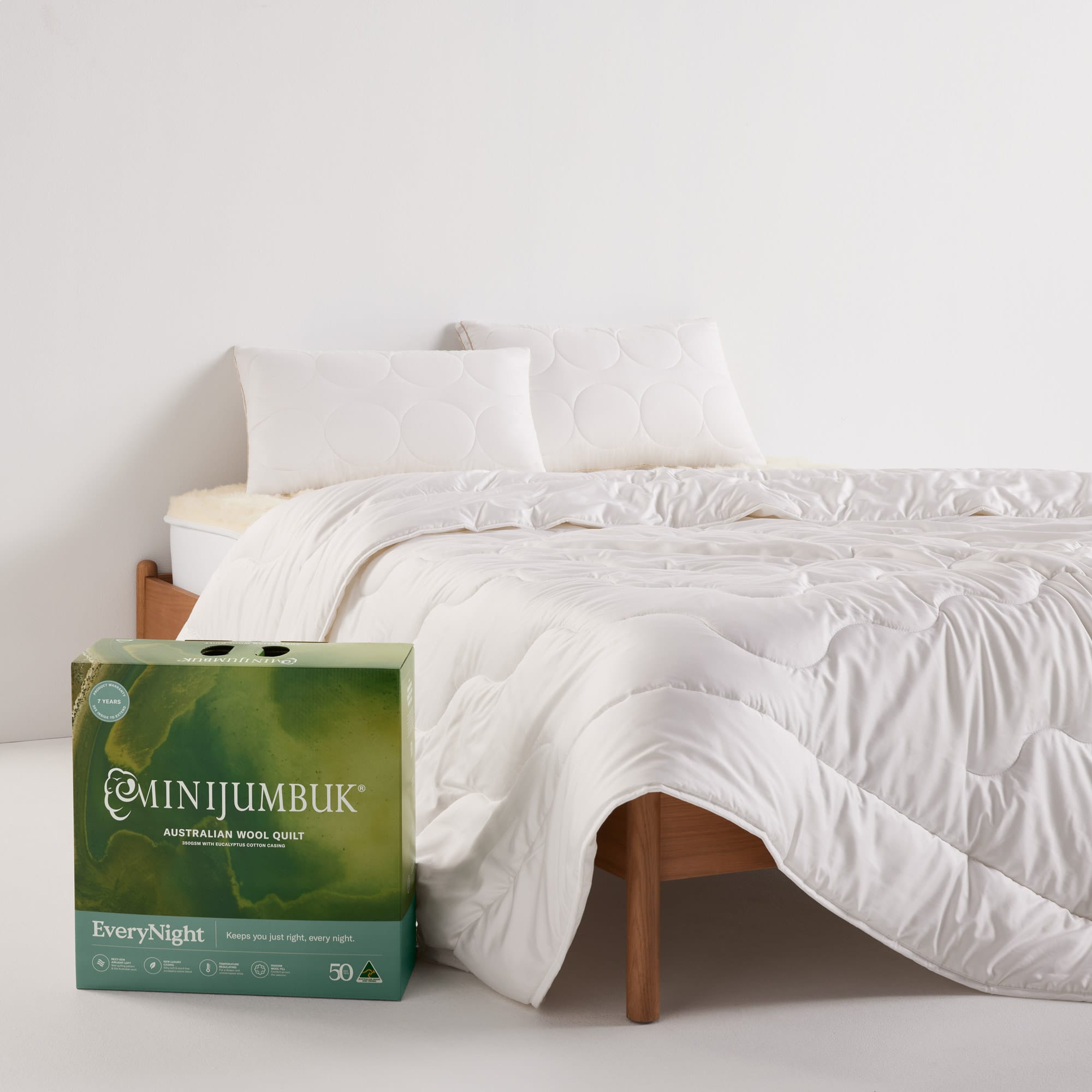 EveryNight Wool Quilt on bed with box packaging - thumbnail #4
