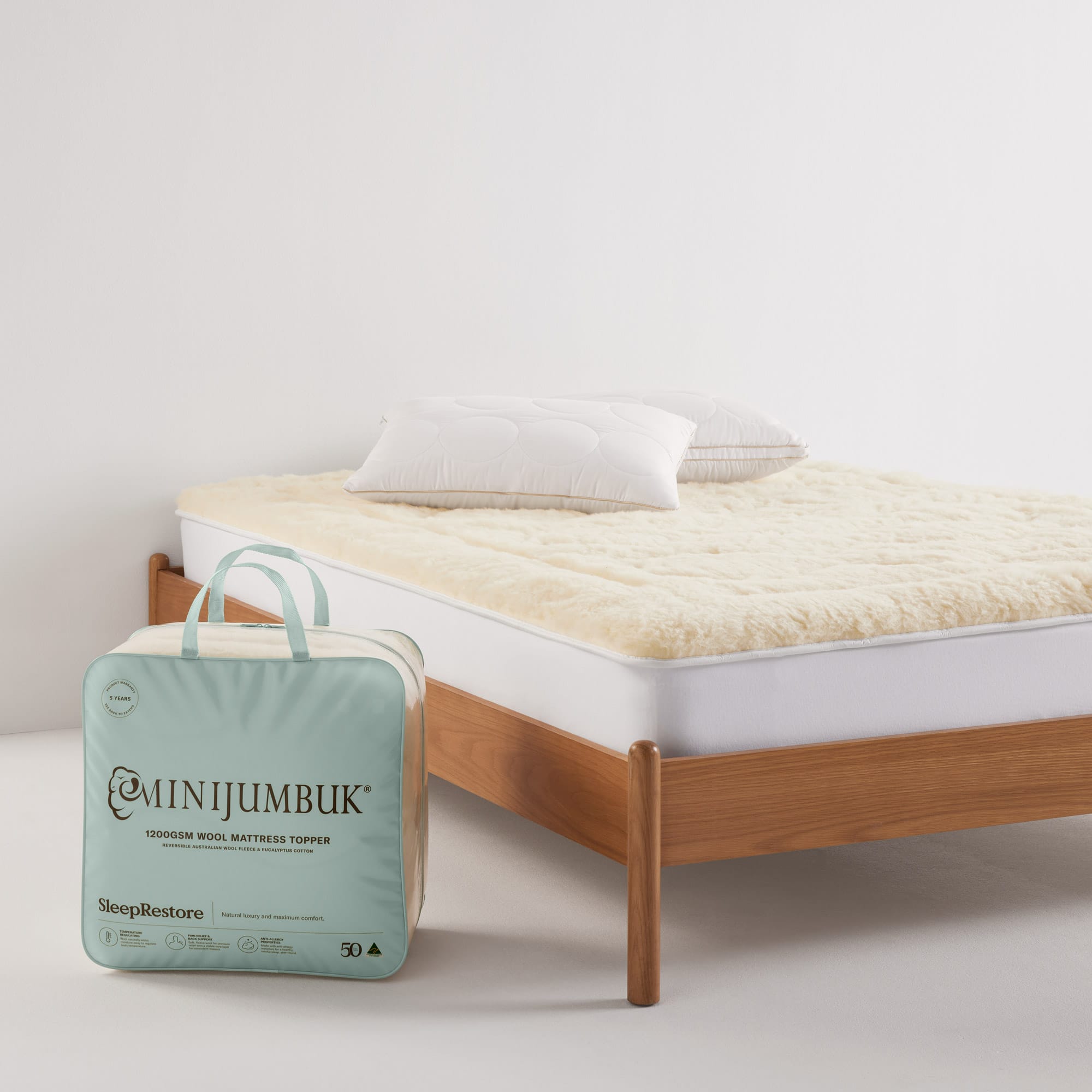 Sleep Restore Mattress Topper on bed with packaging - thumbnail #7
