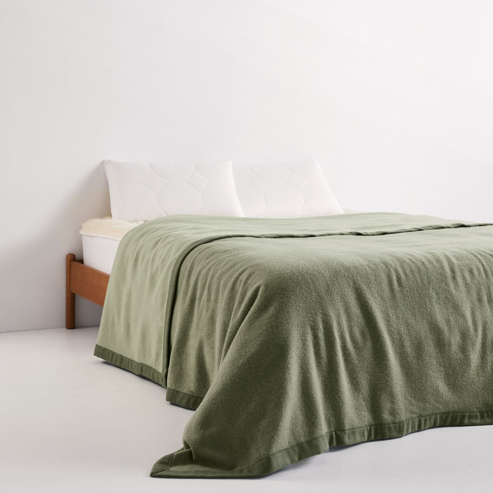 Henley Blanket Olive on bed - thumbnail #3